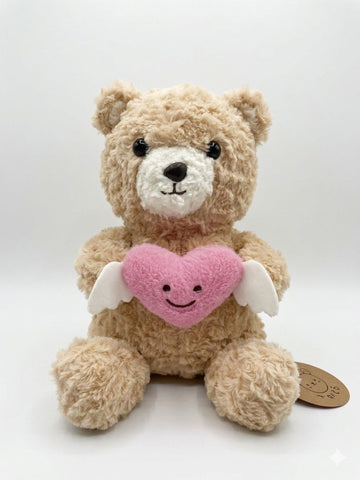 28CM Plush teddy bear with a pink heart featuring a smiley face and small white wings