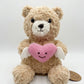 28CM Plush teddy bear with a pink heart featuring a smiley face and small white wings