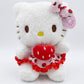 Hello Kitty wearing a strawberry-themed outfit