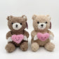 28CM Plush teddy bear with a pink heart featuring a smiley face and small white wings