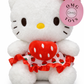 Hello Kitty wearing a strawberry-themed outfit
